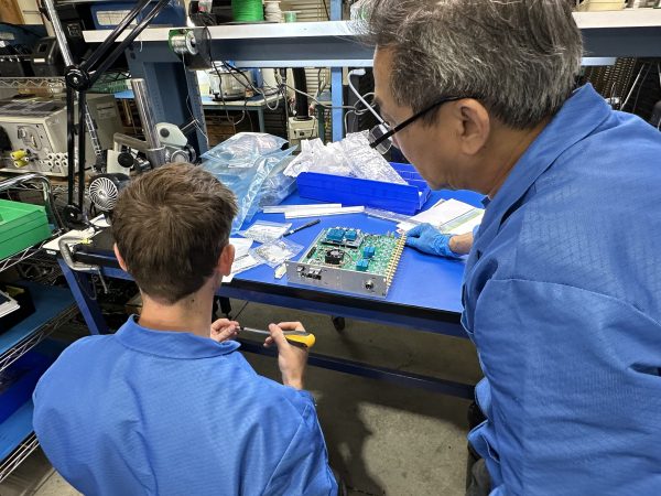 Manufacturing engineer and technician complete the box build assembly